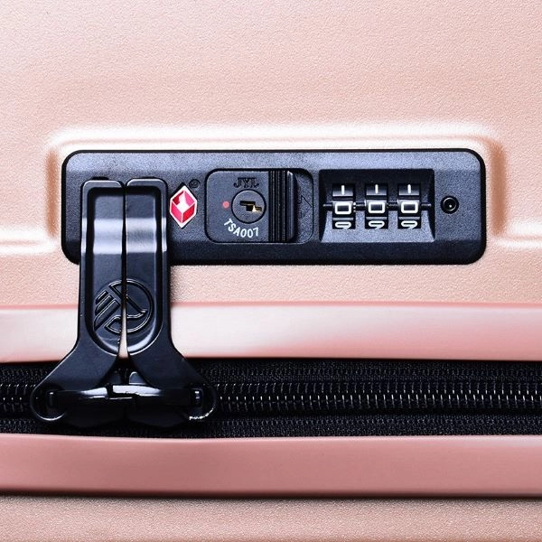 close up of tsa lock on pink luggage - best luggage brands singapore