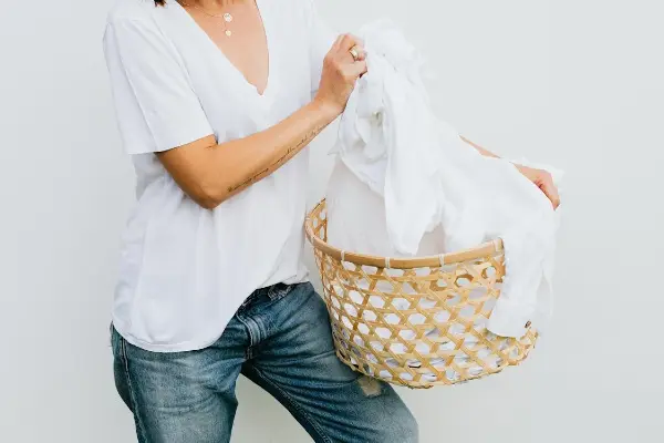 woman holding laundry basket best dryer machine singapore