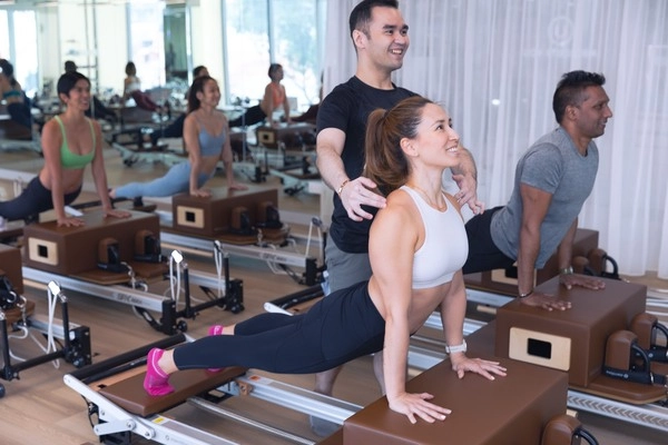 absolute pilates conducting a pilates class for beginners in singapore