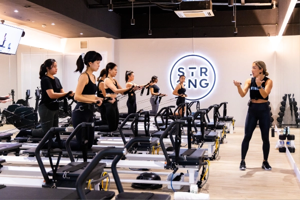 a group of ladies trying the rowfromer class at Strong, one of the best pilates studio in singapore