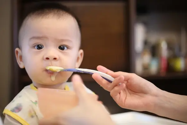 Baby being fed