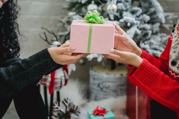 exchanging christmas gifts with colleagues in singapore