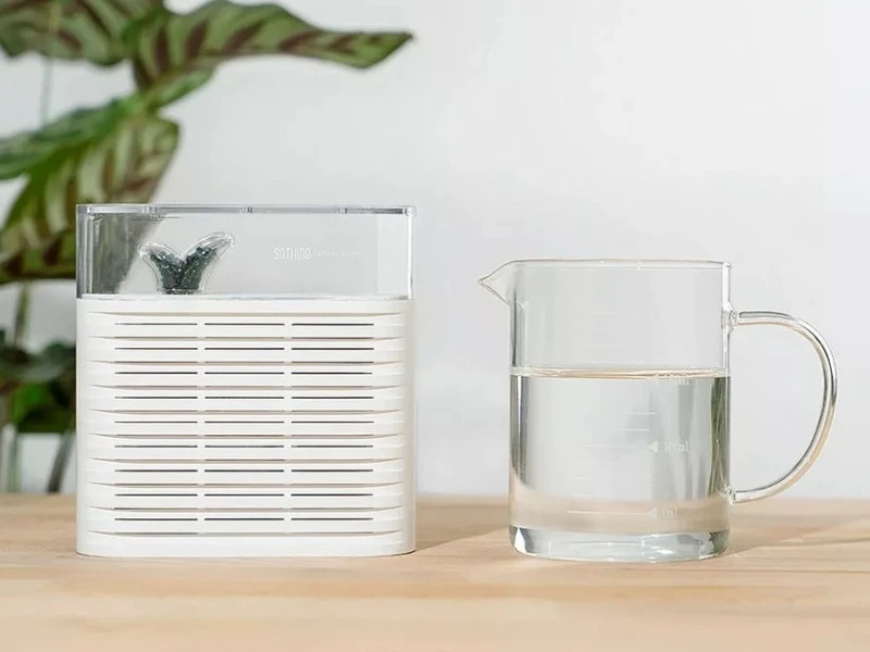 best dehumidifier singapore pitcher of water next to a dehumidifier