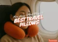 woman sleeping on plane with the best travel pillow singapore