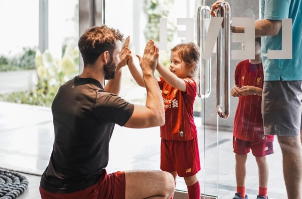 Level instructors giving a high-five to the kids