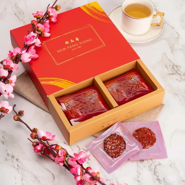 New Peng Hiang bak kwa gift boxes with a side of tea