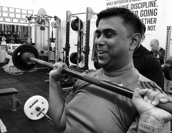 man practising his barbell overhead exercise at THE PIT Singapore