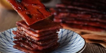 savouring the best bak kwa in singapore with a pair of chopsticks