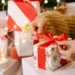 women unwrapping her christmas gift