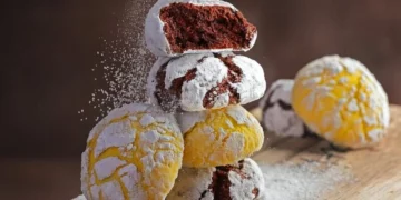 sprinkling powder sugar on hari raya cookies in singapore