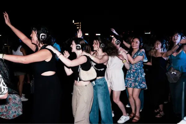 a group of people dancing at the Silent Disco event