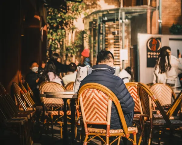 Man sitting at a Shanghai cafe located in a heritage villa