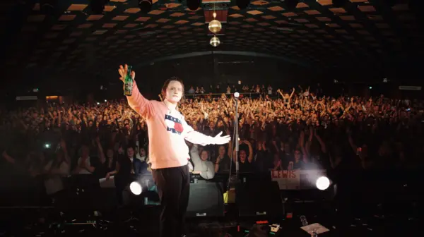 Lewis Capaldi posing with his big group of fans