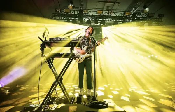 The Wombats singing passionately on stage