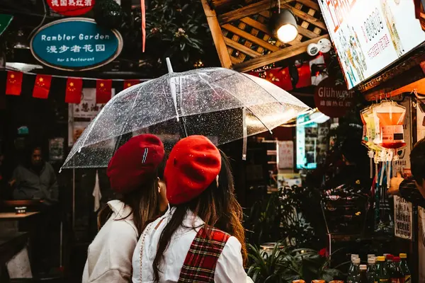 Tianzifang artsy lanes featuring two girls carrying an umbrella