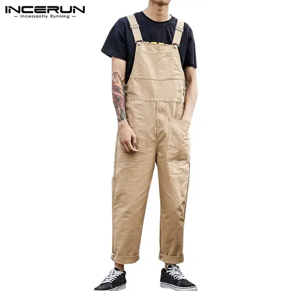 what to wear to f1: beige overalls layered over a top