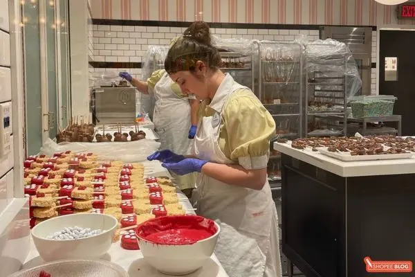 shanghai disneyland guide: staff preparing disney-themed goodies