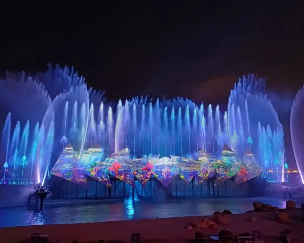 what to do at night singapore: Catch Wings of Time at Sentosa, Beachfront Light & Fireworks Show