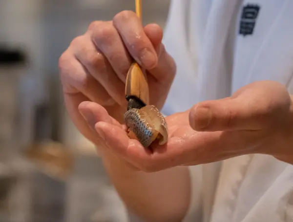 Sushidan chef preparing affordable omakase in tokyo